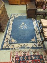 A rectangular blue ground rug