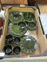 A mid-20th century cream glazed part dinner set to include tureens, plates, soup bowls, cups, etc
