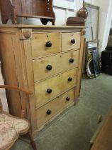 A Victorian waxed pine chest of two short over four long drawers