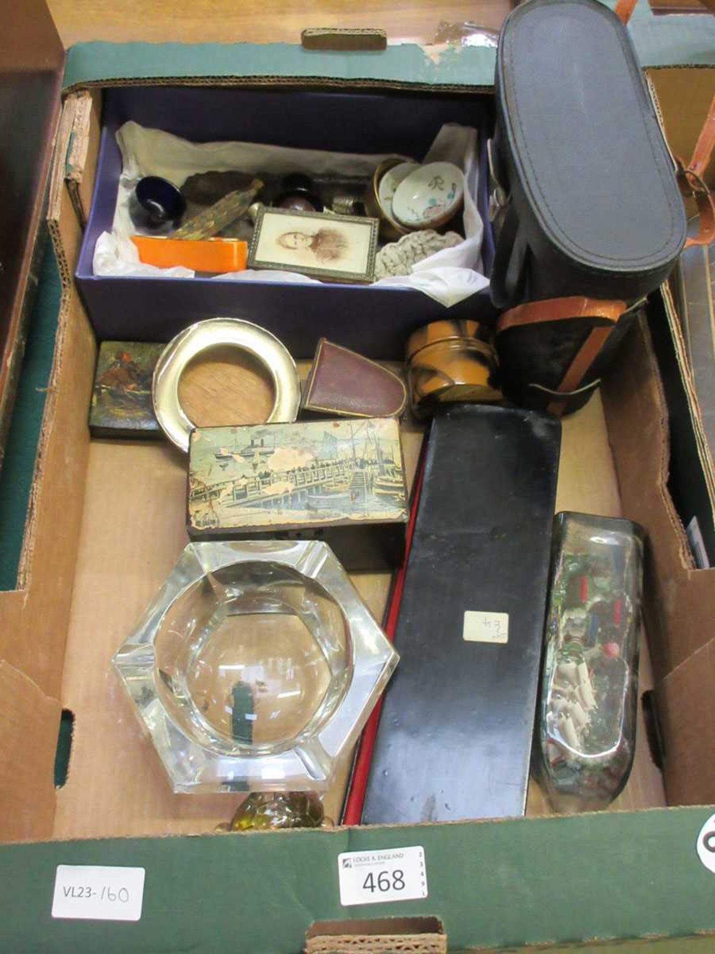 A tray containing ship in bottle, cased set of binoculars, toddy ladle, etc