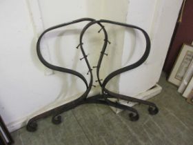 A pair of garden metalwork bench ends