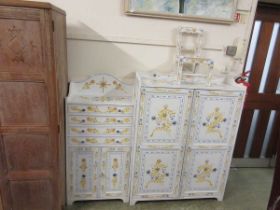 A hand painted child's pine two door wardrobe together with a matching chair and matching tall boy