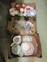 Three trays containing cups, saucers, glass vases, bowls, etc