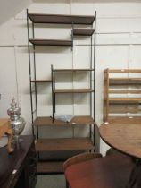 A mid-20th century teak laminated metalwork room divider