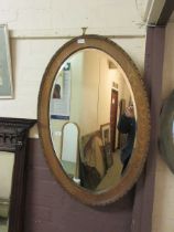 A large oak bevel glass wall mirror