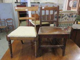 A 19th century oak chair together with a Georgian style mahogany dining chair