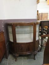 A mid-20th century high quality walnut veneered bow front glazed display cabinet