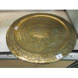 A large eastern style engraved brass tray depicting gentleman and muse