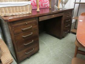 A mid-20th century twin pedestal desk