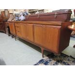 A Greaves & Thomas mid-20th century design teak sideboard having three doors and three drawers