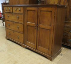 A Victorian mahogany housekeepers cupboard, the top with moulded edge, above two short and three