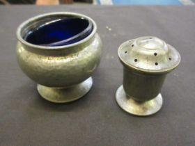 A pewter pepper pot together with a hammered pewter mustard bowl marked 'Liberties'