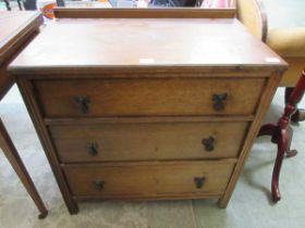 An oak chest of three drawers