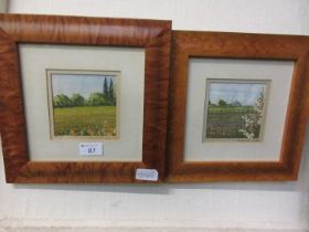 A pair of miniature needlework pictures in maple frames signed Margaret Adler