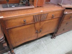 An oak sideboard with two frieze drawers