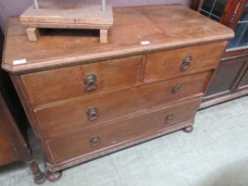 An oak chest of two over two drawers