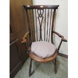 An early 20th century mahogany open arm chair