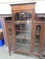 An Edwardian inlaid mahogany and glazed display cabinet on square tapered supports