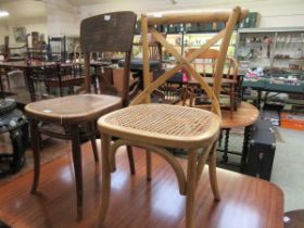 An early 20th century bent wood chair together with a later bent wood and cane seat chair