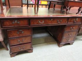 A reproduction burr yew finish pedestal desk with leather inset top