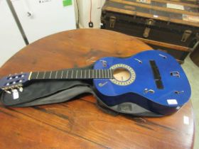 A blue acoustic guitar by Stagg along with soft carry case (Incomplete)