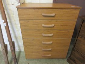 A teak effect six drawer bedroom chest