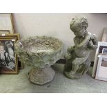 Two concrete garden ornaments comprising of putti and urn