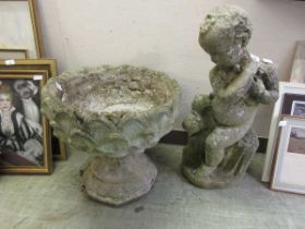 Two concrete garden ornaments comprising of putti and urn