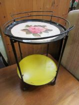 An early metal tea trolley with painted design