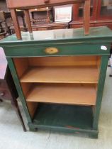 A green painted open bookcase