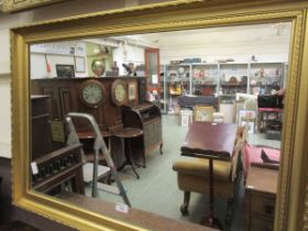 A modern rectangular gilt framed wall mirror