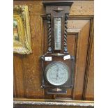 An oak framed barometer/thermometer