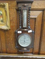 An oak framed barometer/thermometer