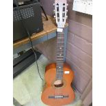 An acoustic guitar by Encore