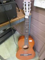 An acoustic guitar by Encore