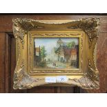 A small reproduction gilt framed oil of continental street scene