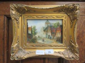 A small reproduction gilt framed oil of continental street scene