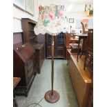A beech standard lamp with floral shade