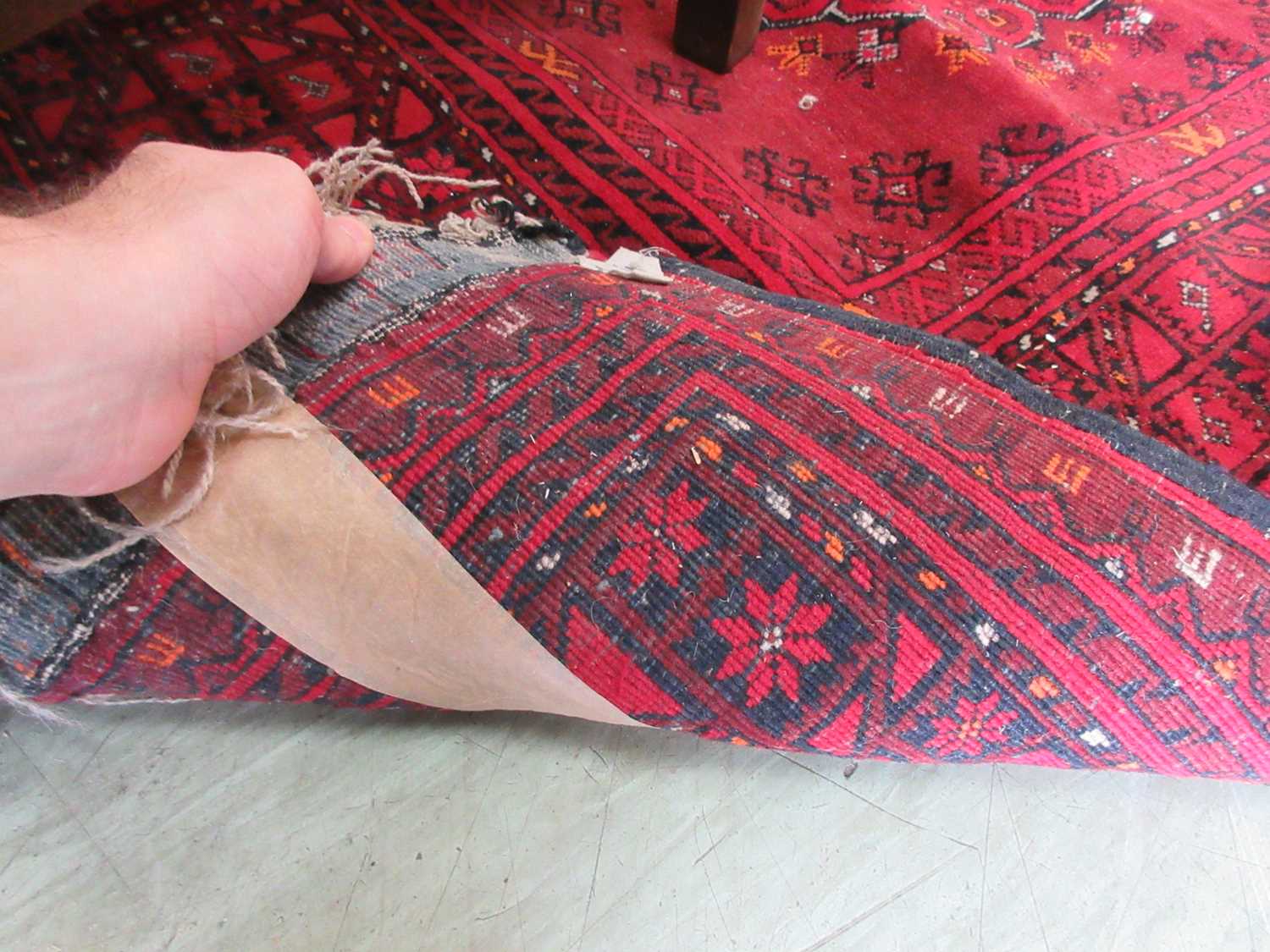 A Turkoman style red carpet Fringe appears to have been damaged on one side. Tape to back of rug, - Image 3 of 3