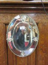An Italian style bevelled glass mirror