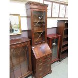 A reproduction mahogany bureau bookcase with glazed door