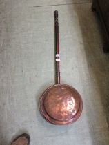 A copper warming pan