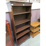 A reproduction mahogany open fronted bookcase