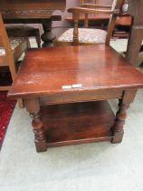 A modern oak square coffee table with under tier