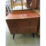 A 1950s walnut veneered two drawer chest