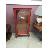 A reproduction yew and glazed display cabinet