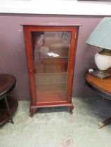 A reproduction yew and glazed display cabinet