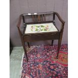 An Edwardian mahogany piano seat with tapestry seat