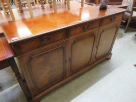 A reproduction mahogany sideboard