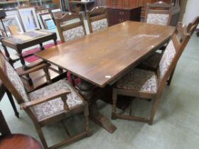 An Old Charm oak dining table with six matching chairs